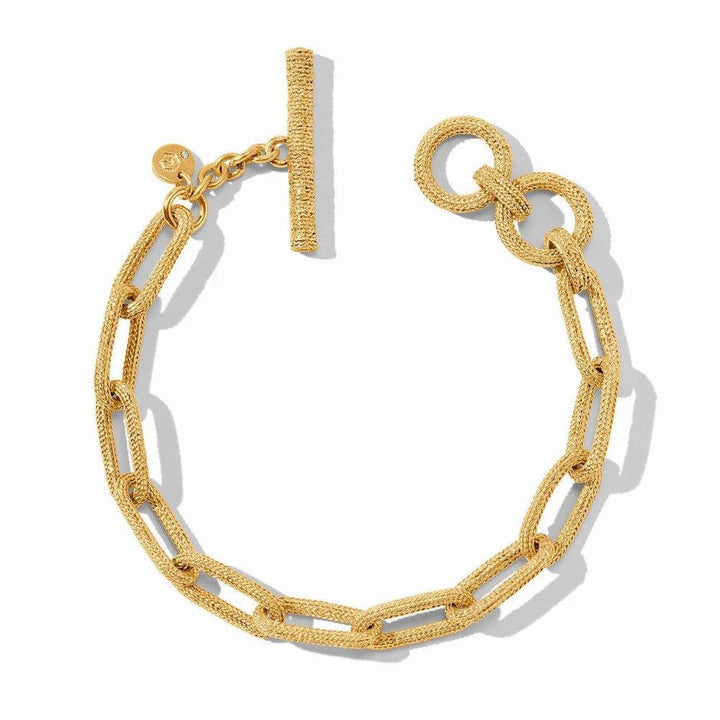Gold paperclip link bracelet with textured finish and toggle clasp.