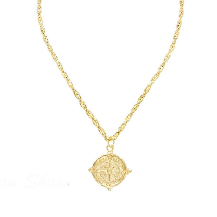 Gold Compass Rope Chain Pendant Necklace with intricate detailing.