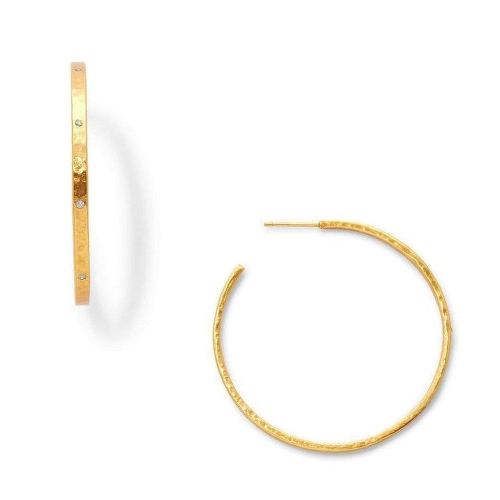 Gold hoop earrings with hammered texture and small diamonds.