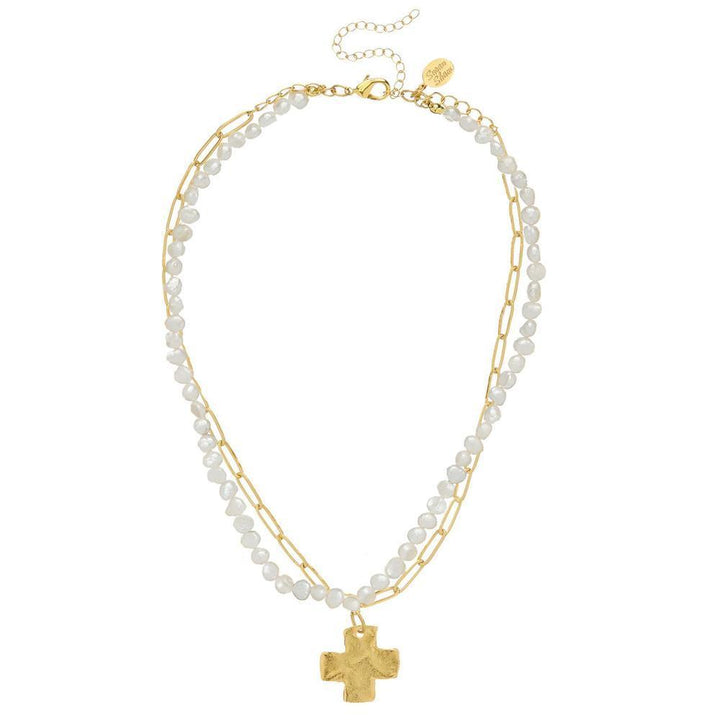 Gold chain and pearl double strand necklace with textured cross pendant.