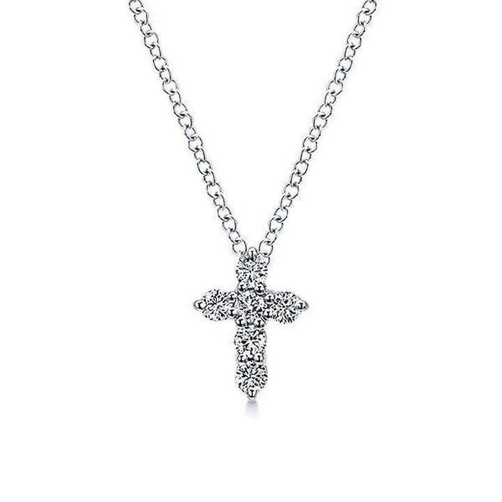Diamond Cross Necklace: Elegant silver chain, delicate cross pendant adorned with sparkling diamonds.