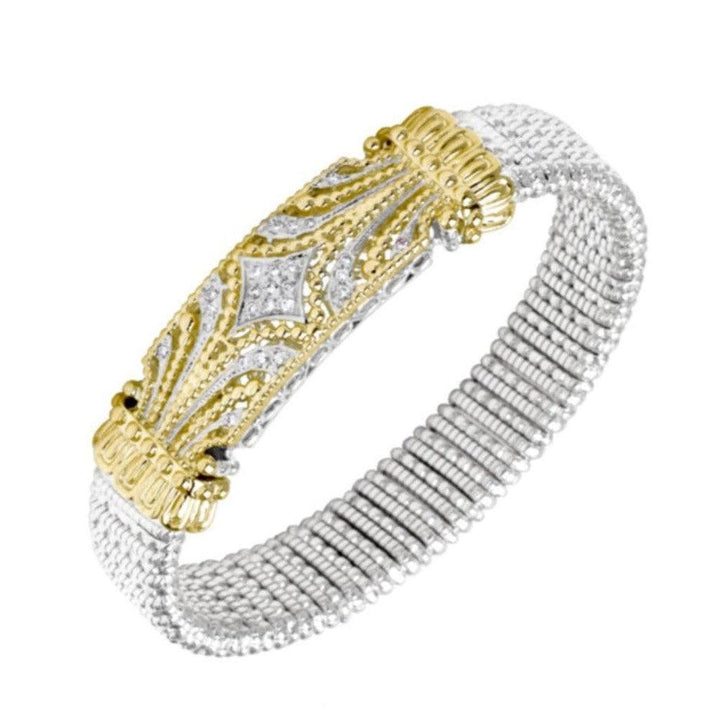 Diamond cuff bracelet with gold and silver design, featuring sparkling diamonds.