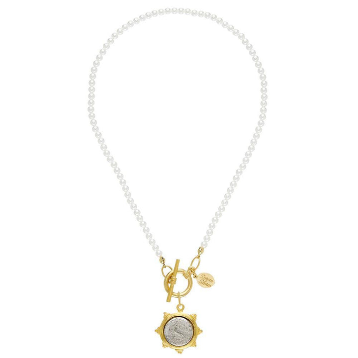 Elegant pearl necklace with gold coin pendant and toggle clasp.