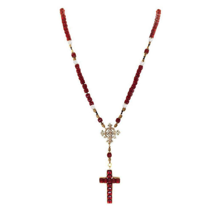 Red and white beaded rosary necklace with gold cross accents.