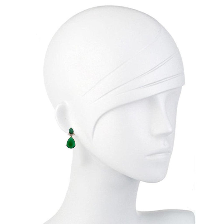 Elegant teardrop emerald green onyx earrings on a mannequin.