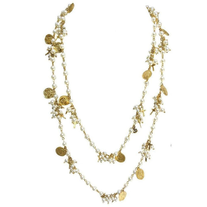 Empress Wrap: Double-strand pearl necklace with gold coin and cross accents.