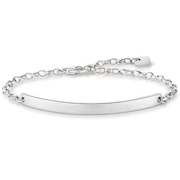 Engravable silver bracelet with chain and heart charm, personalized jewelry gift.