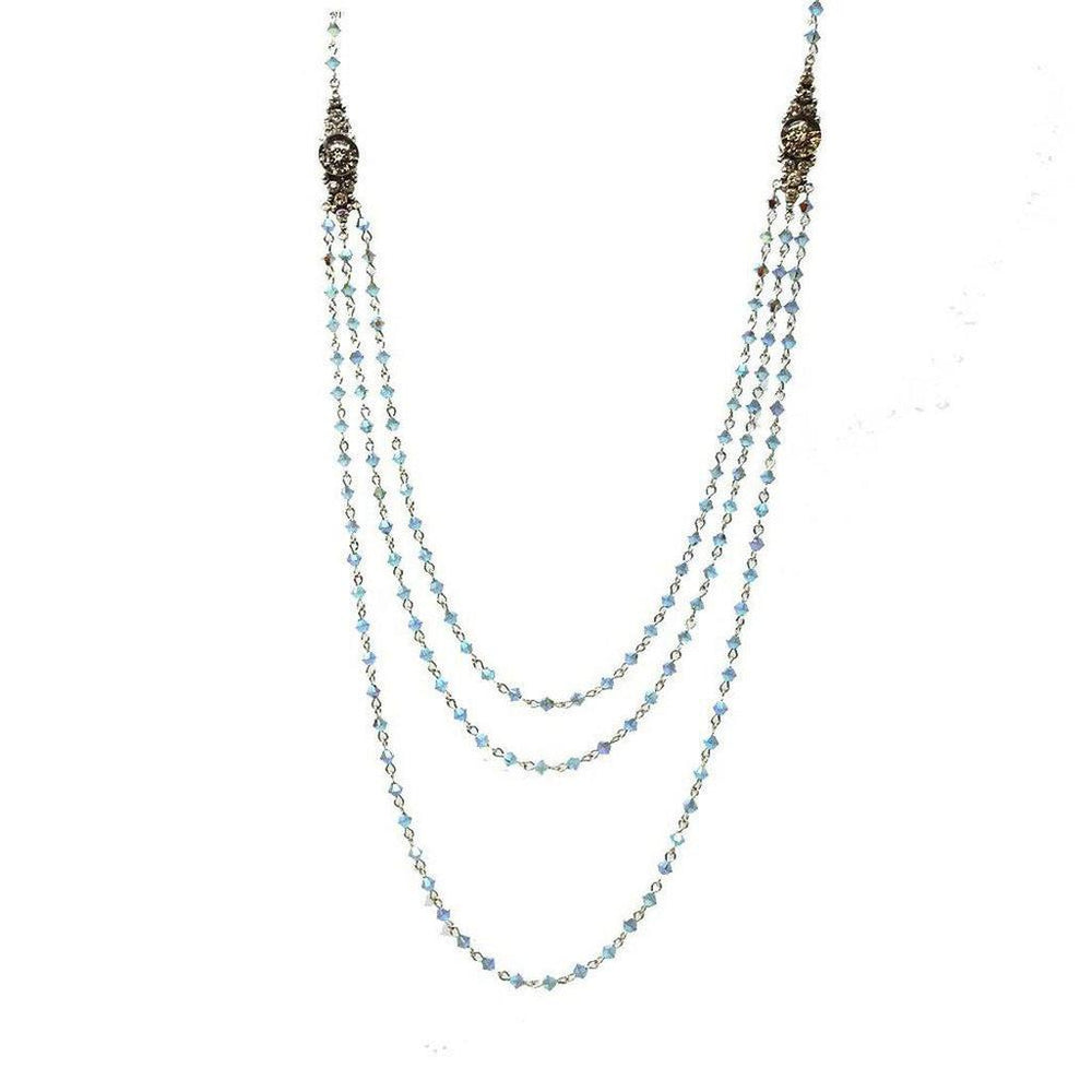 Layered light blue crystal beaded necklace with antique silver accents.