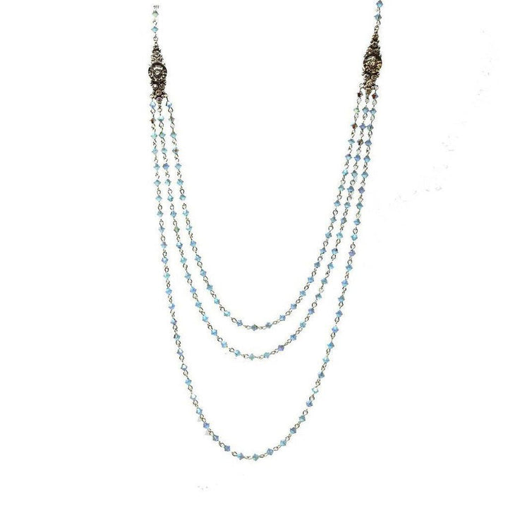 Layered light blue crystal beaded necklace with antique silver accents.