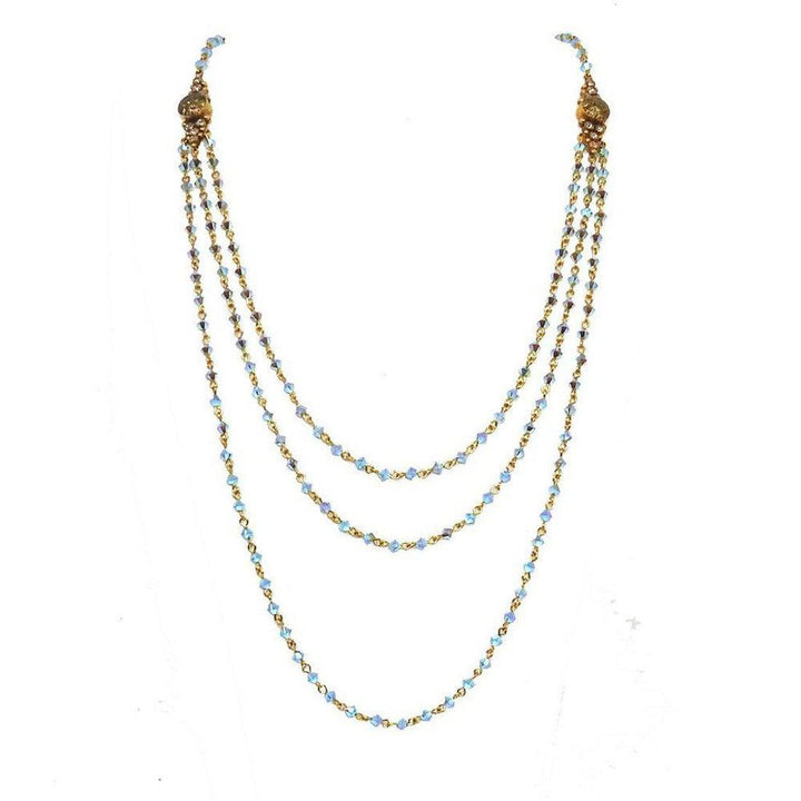 Fay Winged Bicone Magdalena necklace: Three-strand, light blue crystal and gold chain.