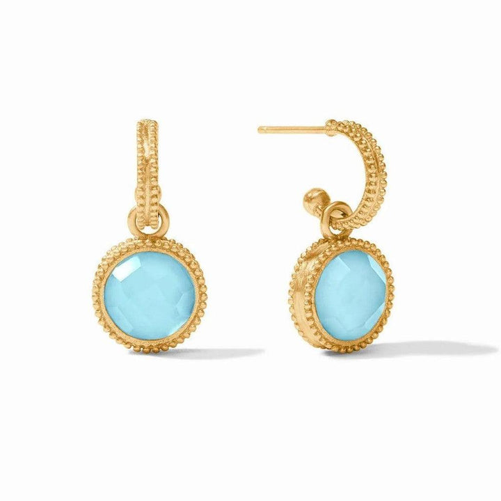 Gold hoop earrings with light blue gemstone accents.