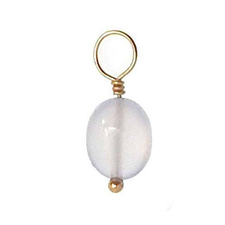 Oval gemstone pendant with gold wire accent.