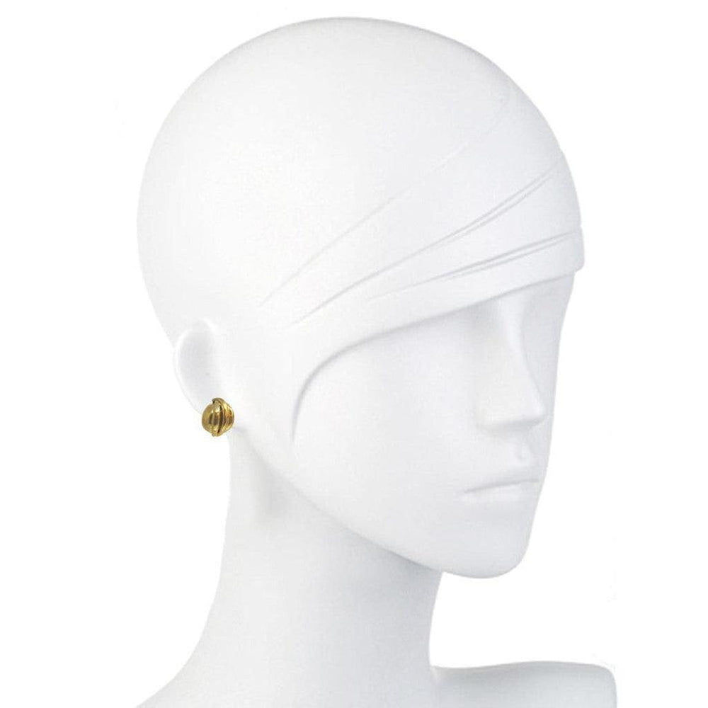 Gold button-style clip earrings on a mannequin.