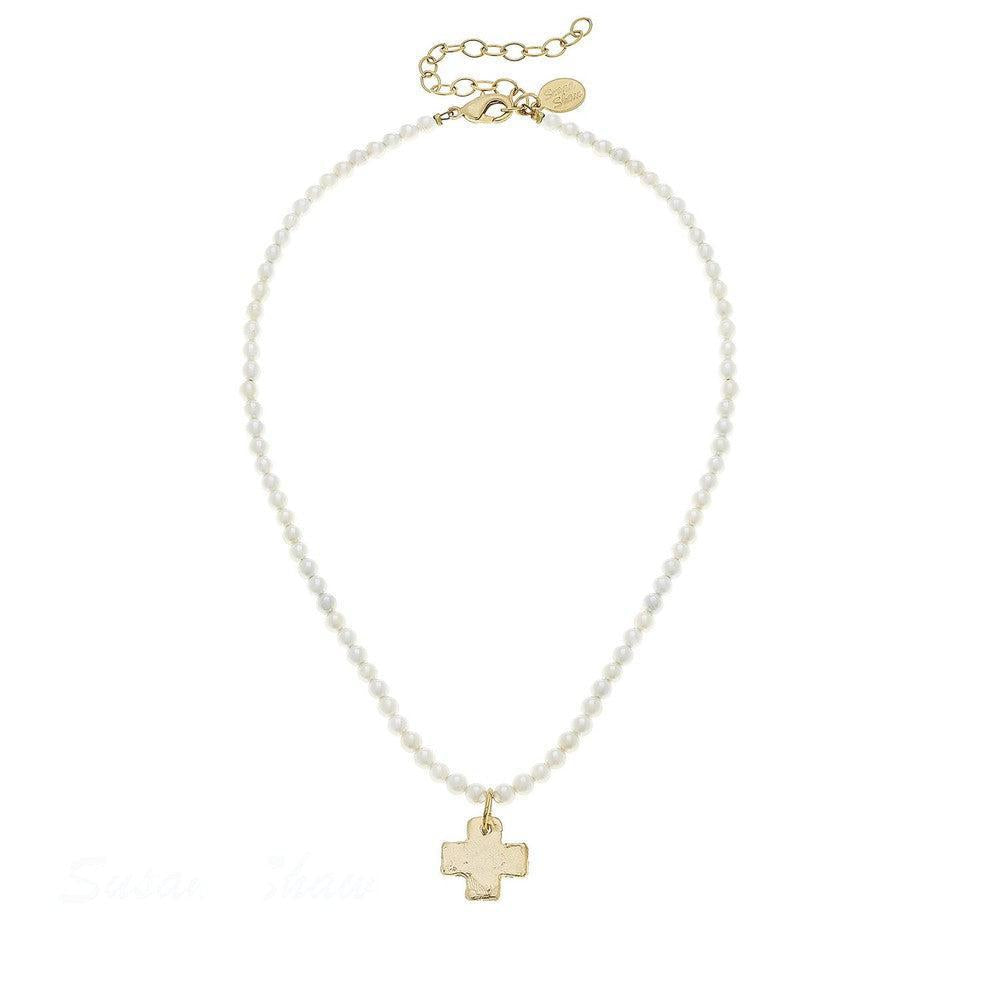 Delicate pearl necklace with gold cross pendant