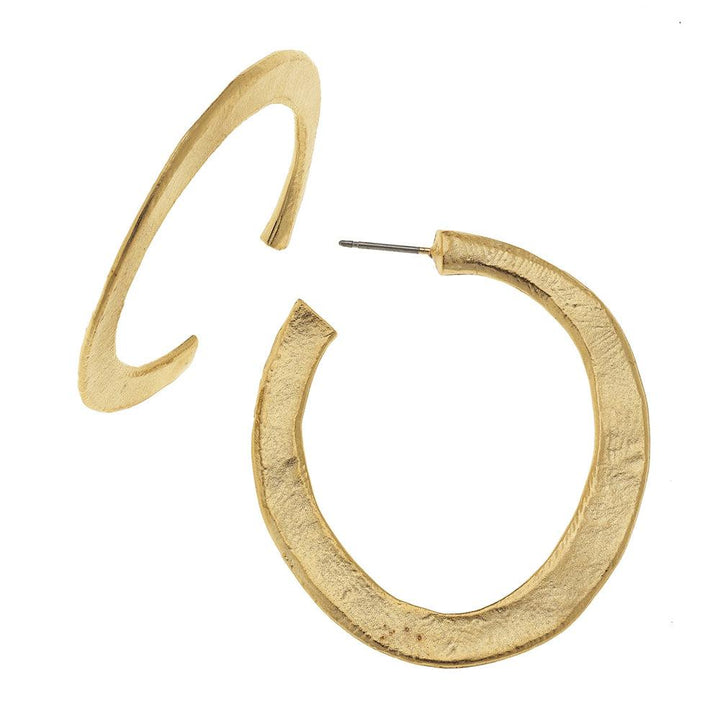Gold hammered hoop earrings; textured, matte finish.