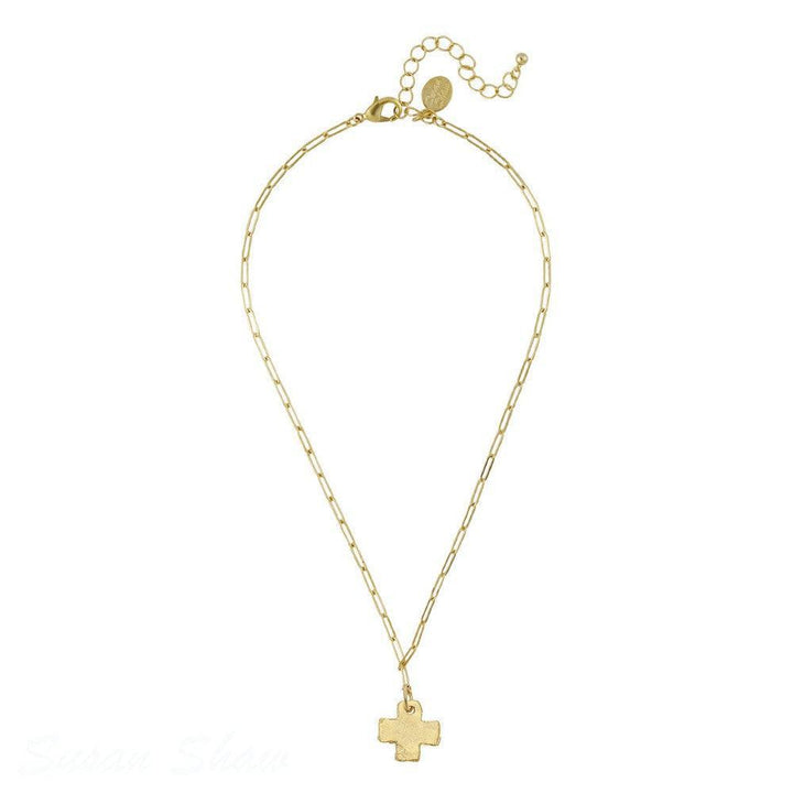 Gold hammered cross pendant necklace on a paperclip chain.