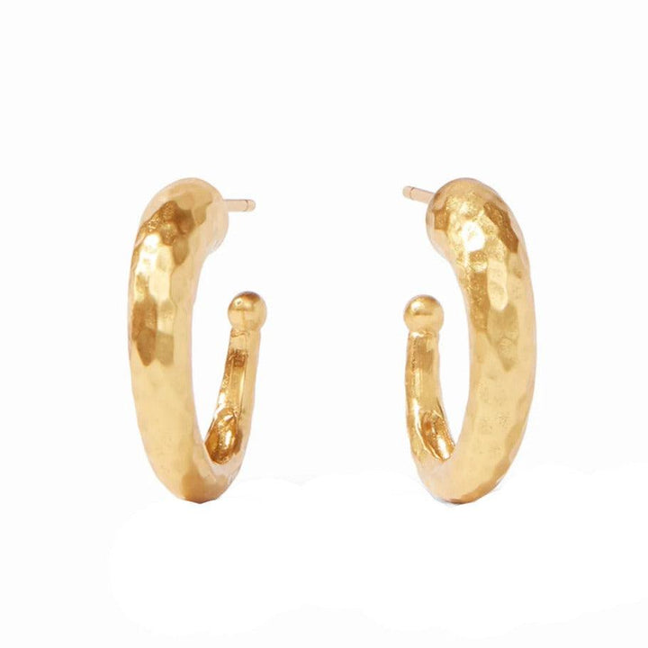 Gold hammered hoop earrings with textured surface.