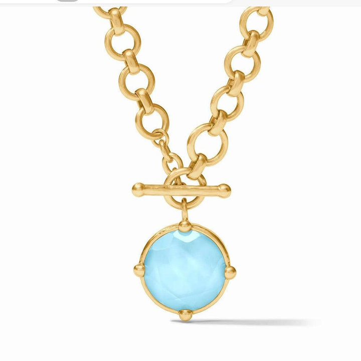 Gold toggle necklace with light blue gemstone pendant