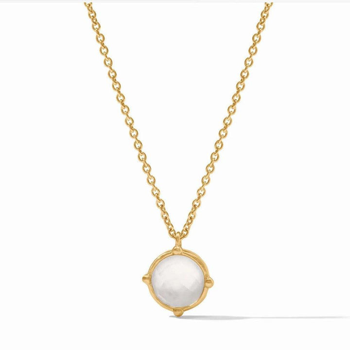 Gold chain necklace featuring a round, white gemstone pendant.