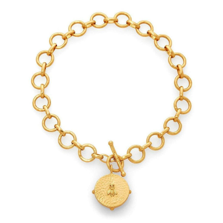 Gold statement necklace with a bee charm, featuring a chunky chain and toggle clasp.
