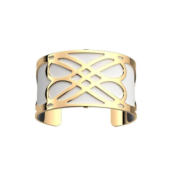 Gold cuff bracelet with white inlay and intricate design.