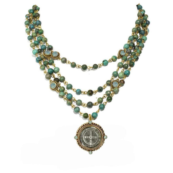 Turquoise and gold beaded necklace, layered design with a medal pendant.
