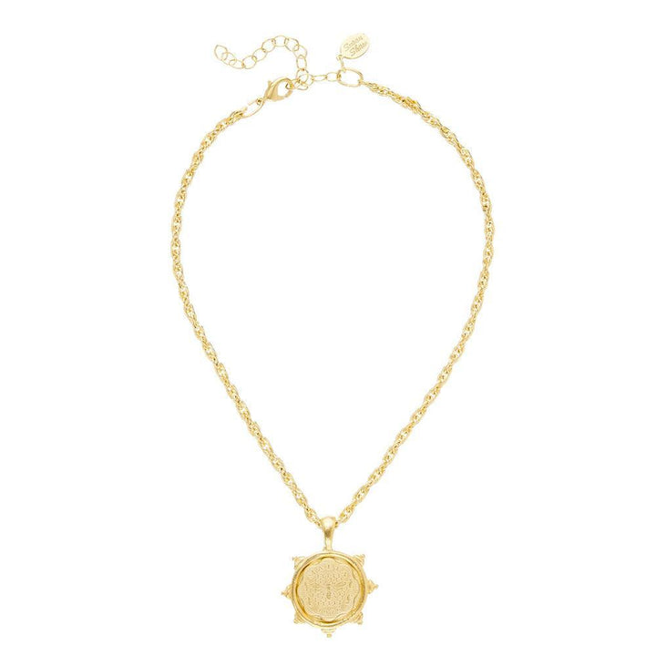 Gold rope chain necklace with ornate medallion pendant.