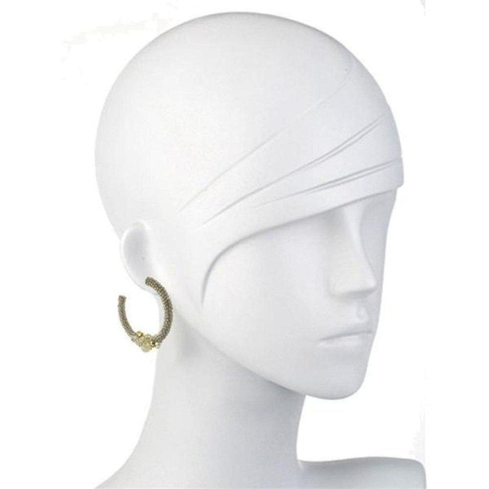 Beaded silver hoop earrings on a mannequin, showcasing detailed texture.