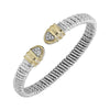 Open bracelet with diamond tips; silver and gold textured design.