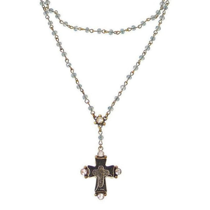 Double-strand beaded necklace with antique-style cross pendant.