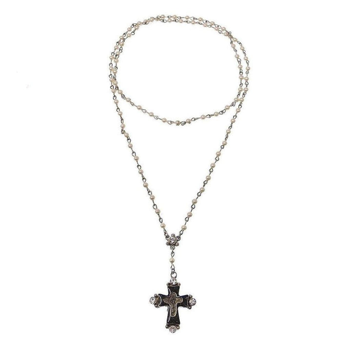 Elegant pearl rosary necklace featuring a dark cross pendant accented with sparkling crystals.