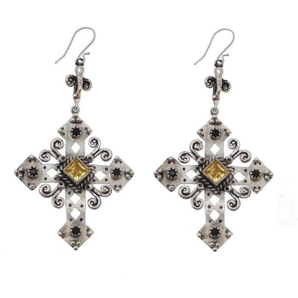 Silver cross earrings with yellow and black stones.