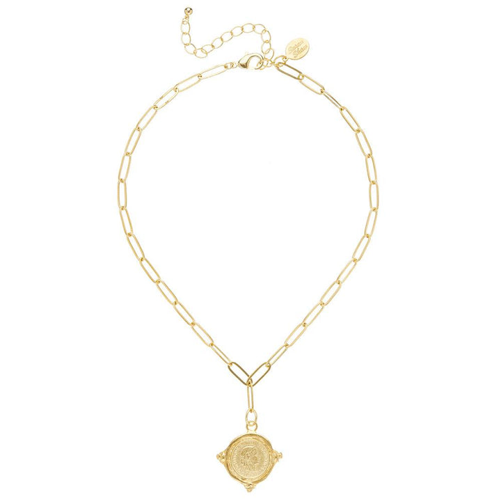 Gold coin pendant necklace on a paperclip chain.