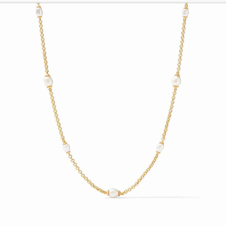 Marbella Pearl Station Necklace: Elegant gold chain with five lustrous pearls.