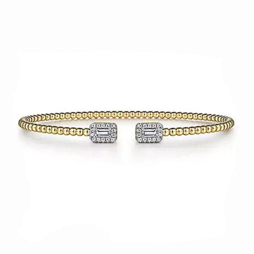 14K gold beaded cuff bracelet featuring baguette diamond accents.
