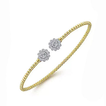 14K yellow gold Bujukan split cuff bracelet with diamond flower accents.
