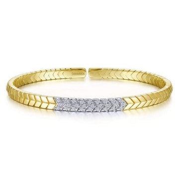 Chevron cuff bracelet in 14k gold with diamond accents.

