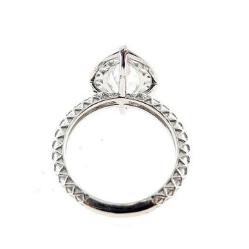 White gold marquise diamond ring, showcasing a detailed textured band.
