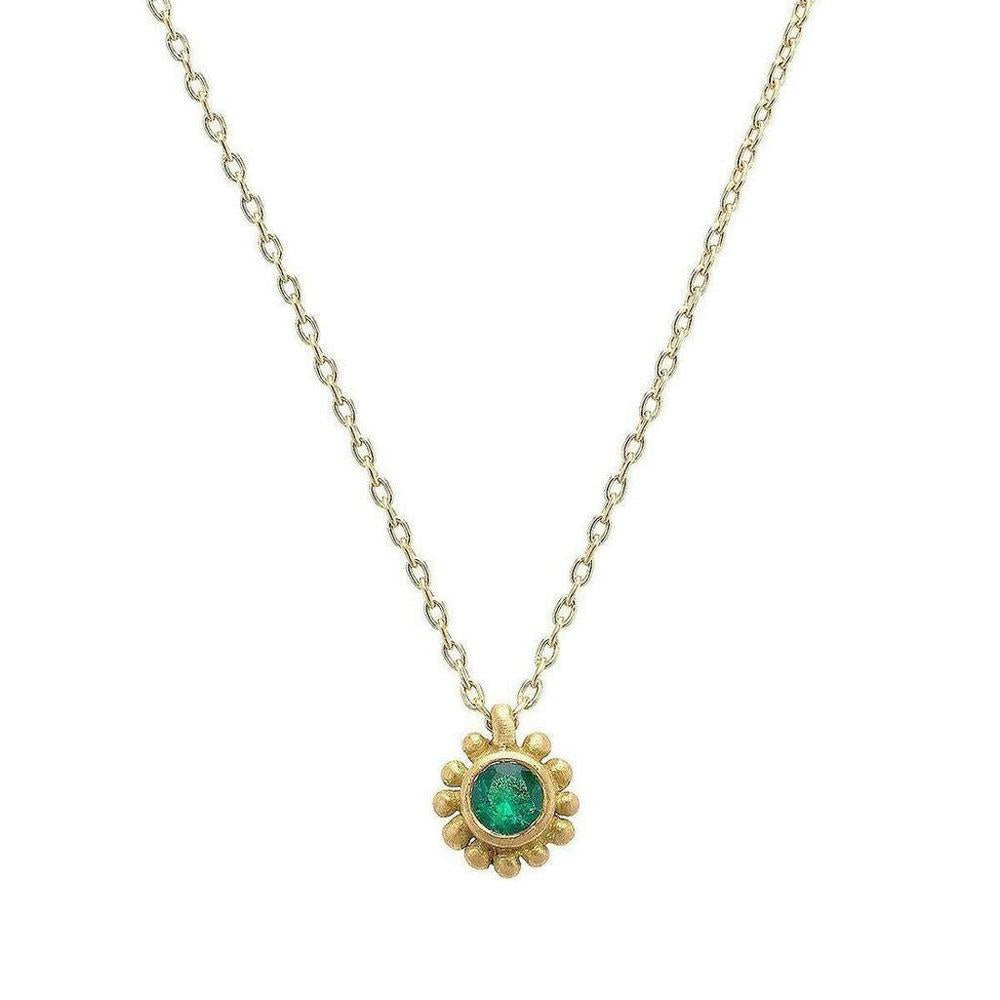 18k yellow gold necklace featuring a vibrant emerald gemstone in a delicate sunflower design.
