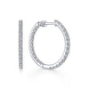 1.2" inside-out diamond hoop earrings; sparkling white gold.
