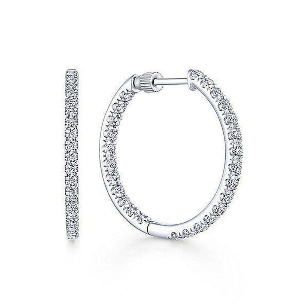 1.2" inside-out diamond hoop earrings; sparkling white gold.
