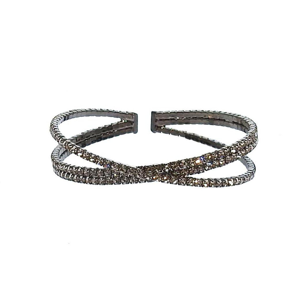 Silver cuff bracelet with three rows of sparkling crystals, crisscross design.
