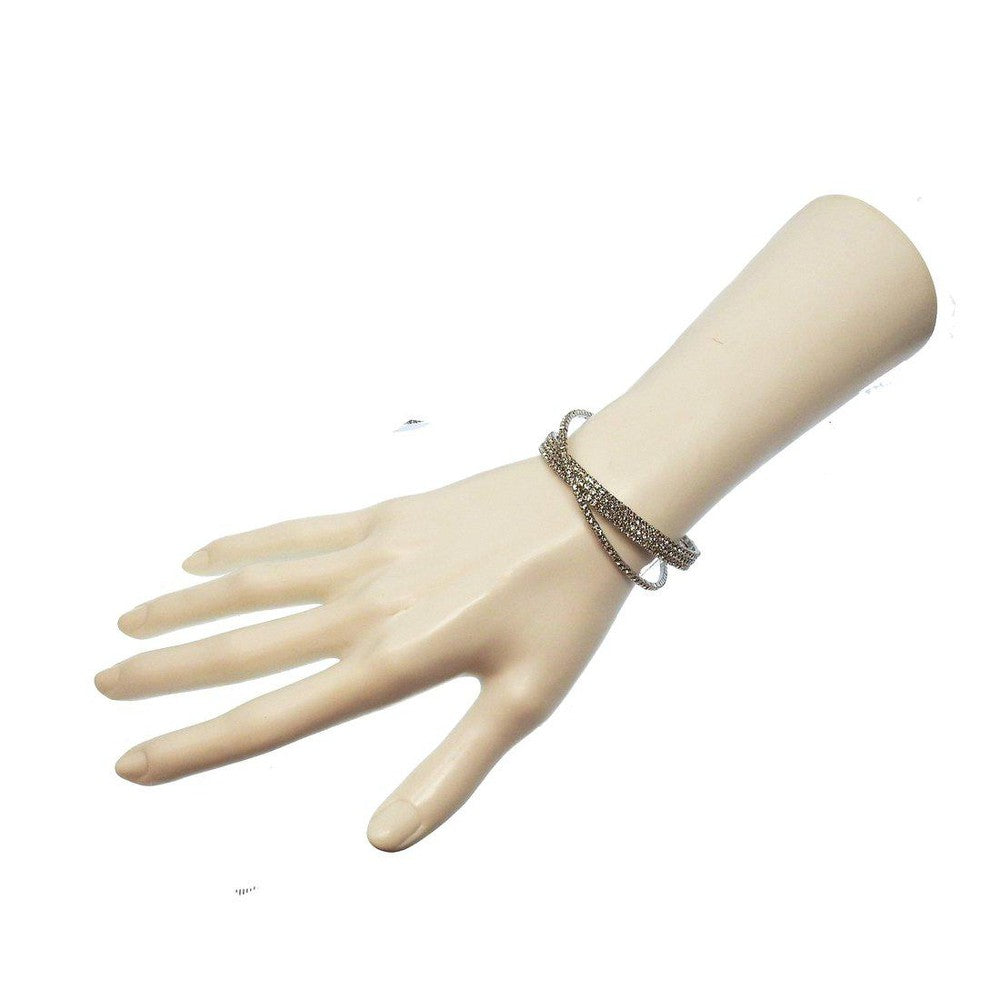 Silver crystal cuff bracelet, four rows of sparkling stones, on a mannequin wrist.
