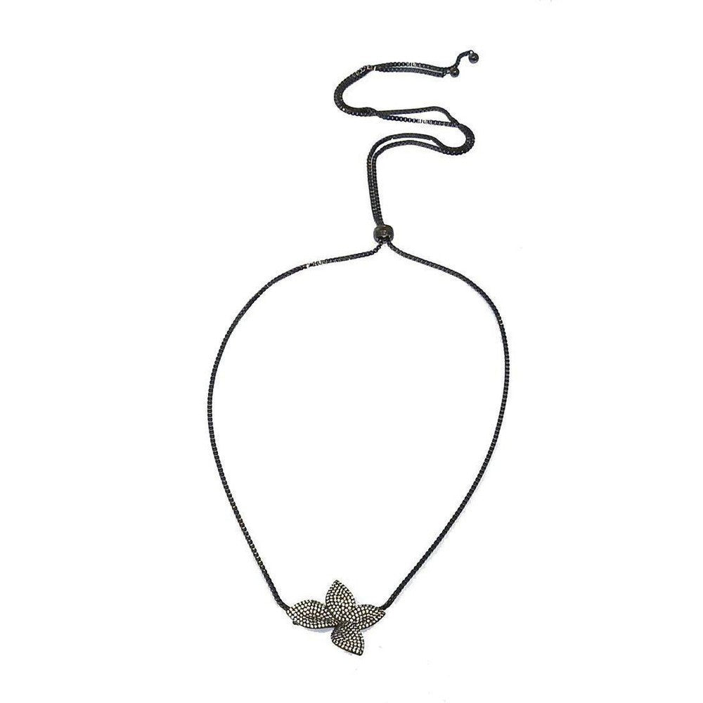 Adjustable flower slide necklace with black chain and pave diamond flower pendant.
