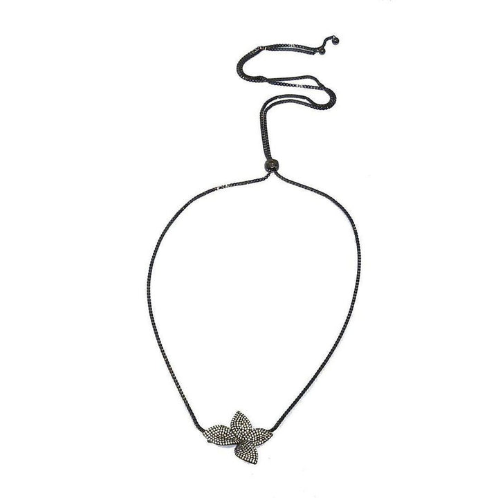 Adjustable flower slide necklace with black chain and pave diamond flower pendant.
