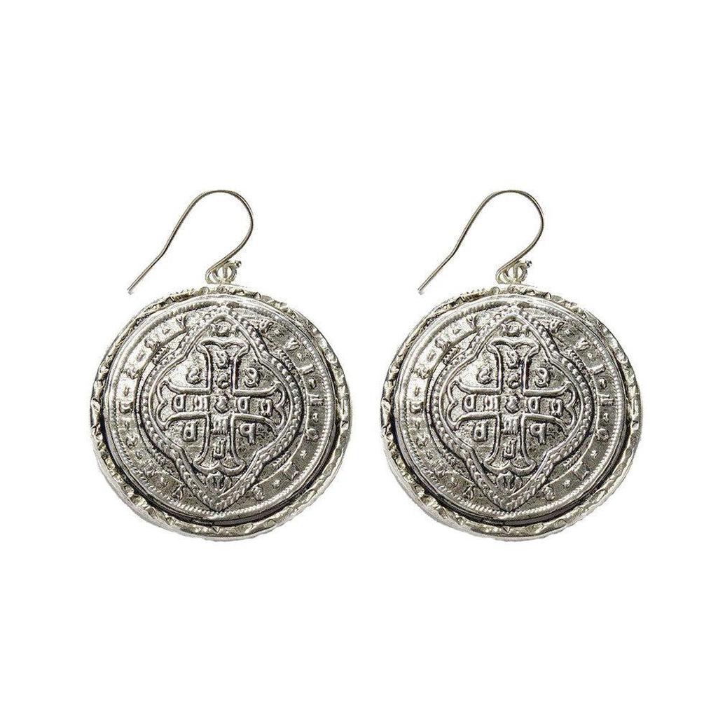 Alcazar silver coin hook earrings with ornate detailing.
