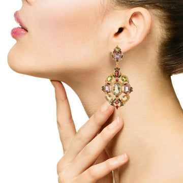 Amethyst, peridot, garnet, and citrine gemstone earrings; gold setting; woman's profile.
