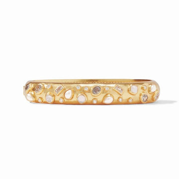 Gold bangle bracelet adorned with various sized pearls and gemstones.
