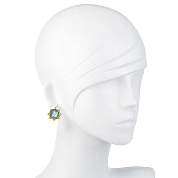 Aqua glass fleur-de-lis earrings on a mannequin.
