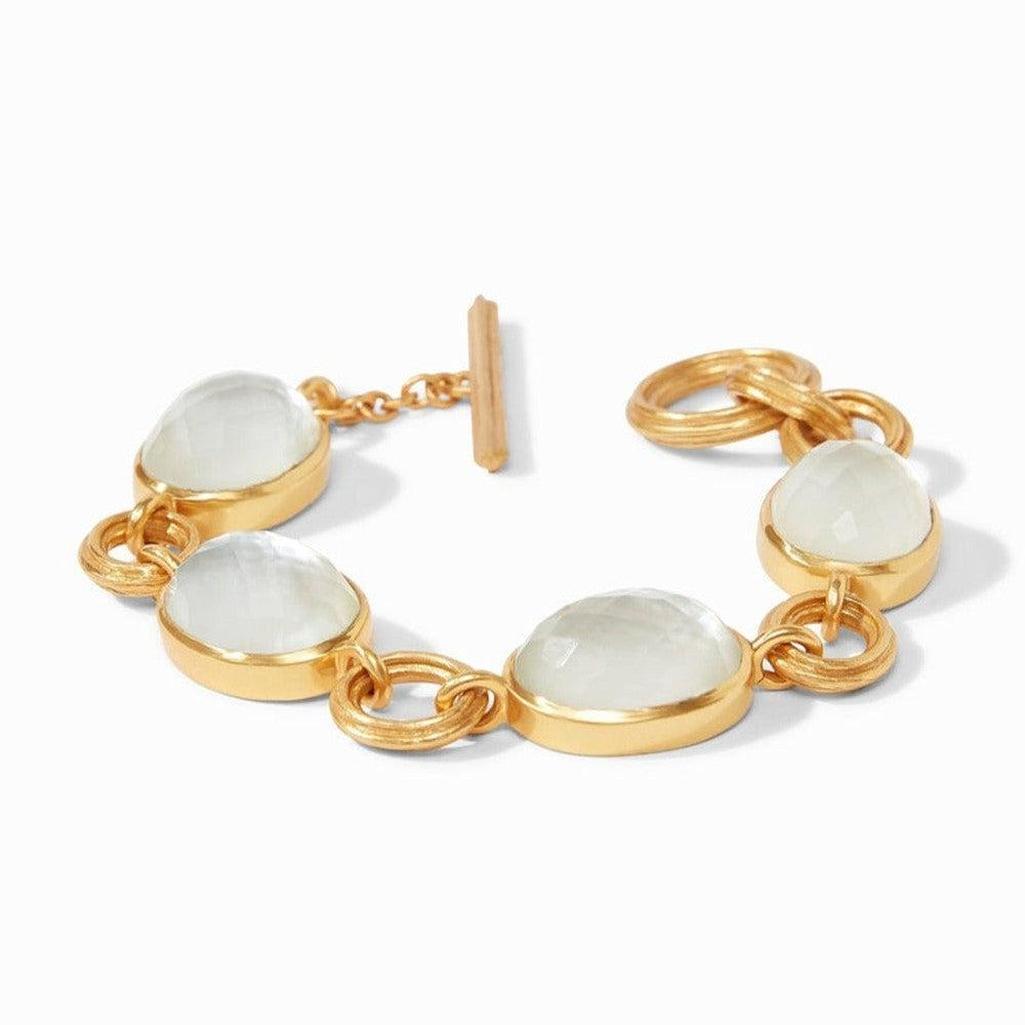 Gold Barcelona bracelet with milky white stones and toggle clasp.

